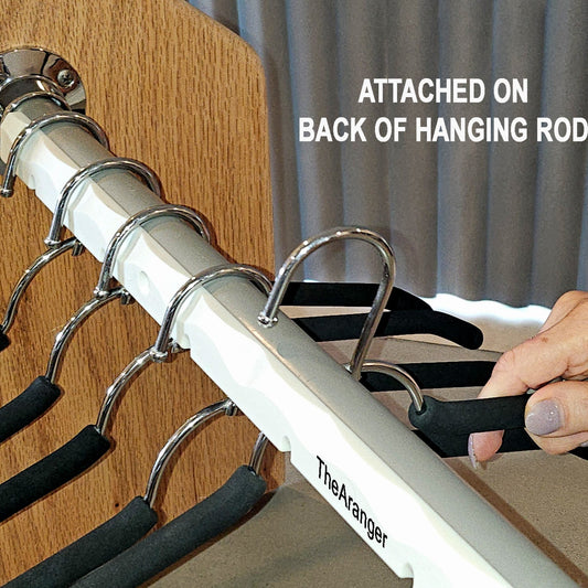 Closet hanging rod organizer installed with hangers neatly arranged